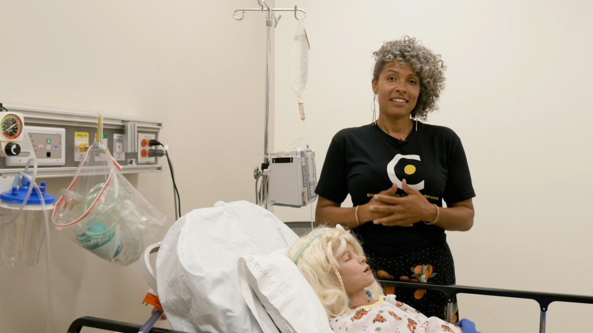 ASU nursing Clinical Associate Professor Dawn Augusta talks in a mock hospital setting