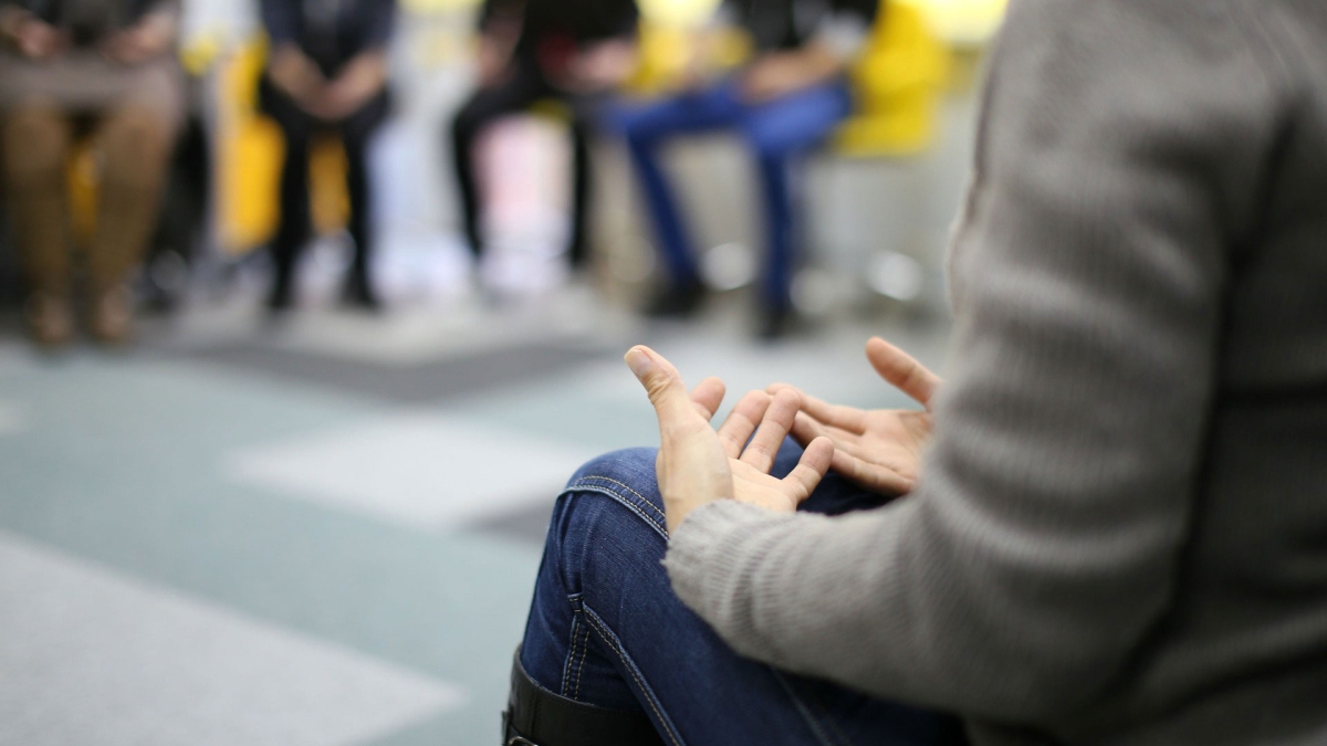 group of people talking in a circle