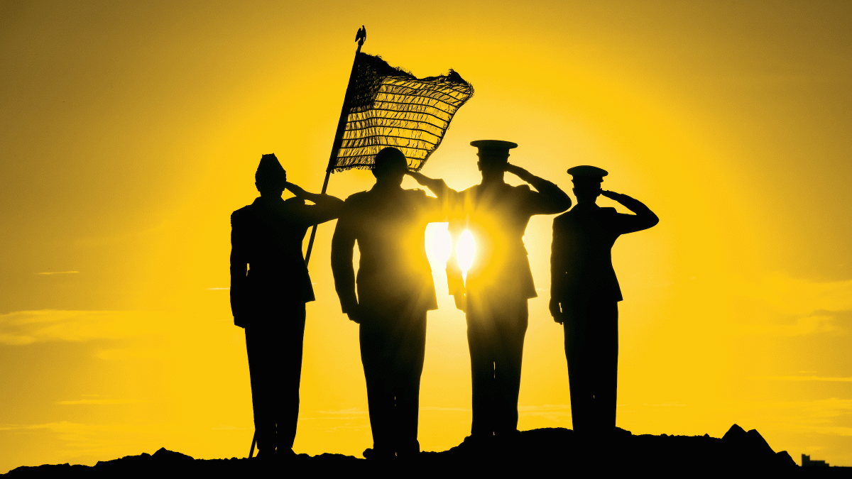 Military members are silhouetted by the sun while saluting