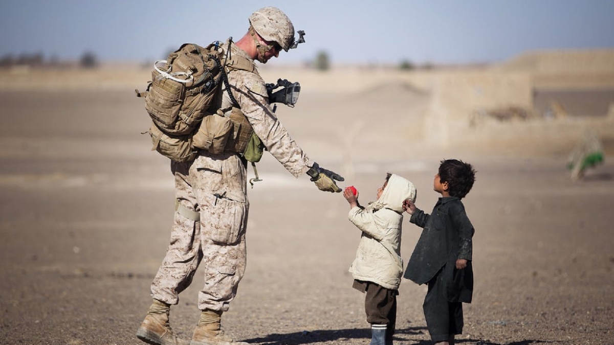 soldier accepting gift from children