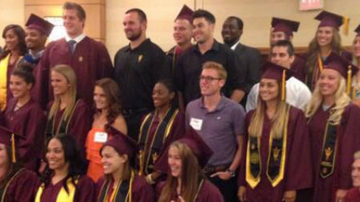 ASU student athletes in caps and gowns at graduation