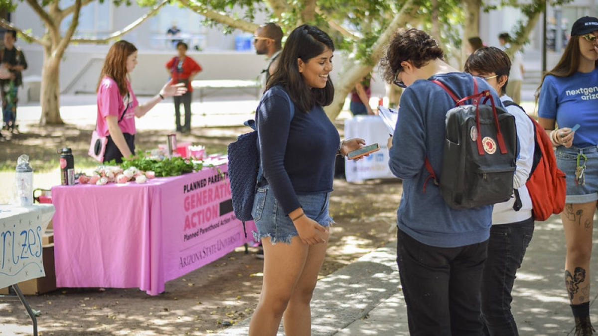 ASU students talking at the Student Services Lawn at ASU Tempe campus on National Voter Registration Day 2019