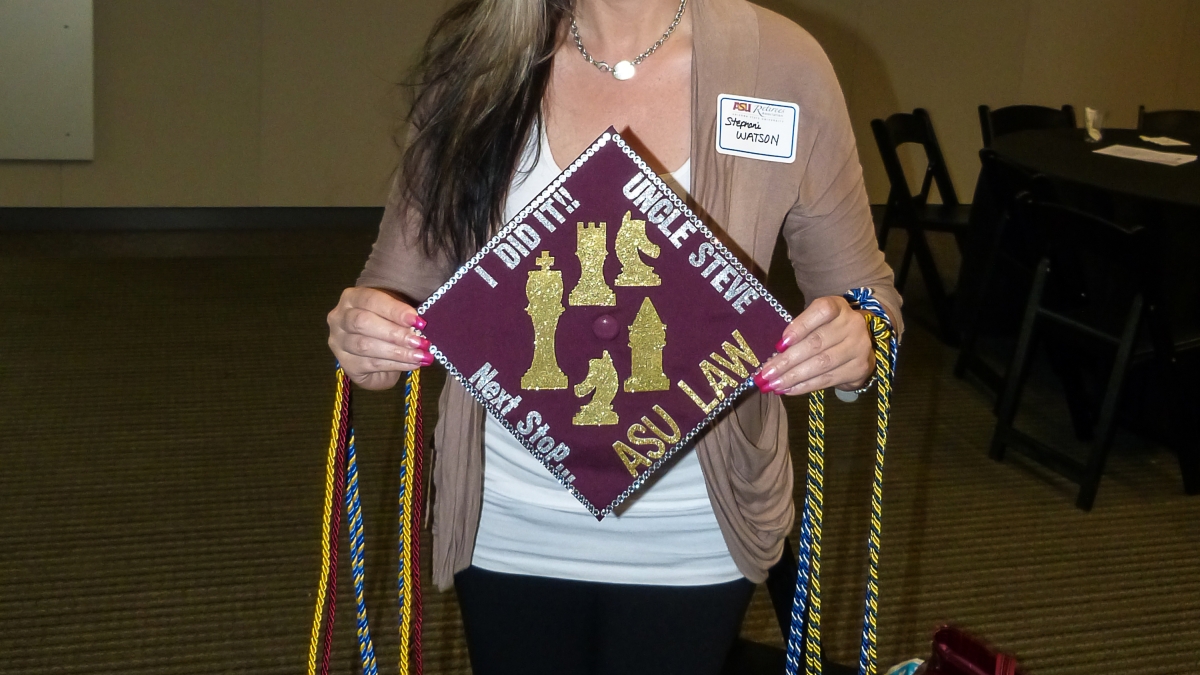 Stephani Watson holds her ASU grad cap