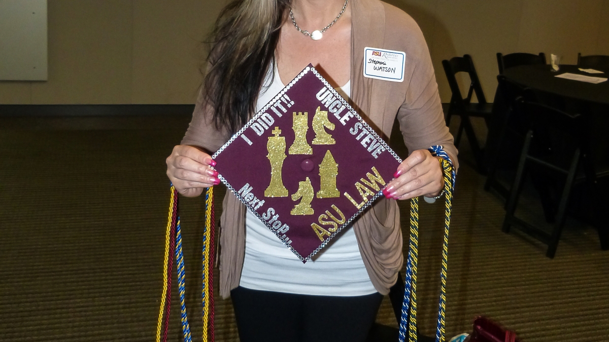 Stephani Watson holds her ASU grad cap