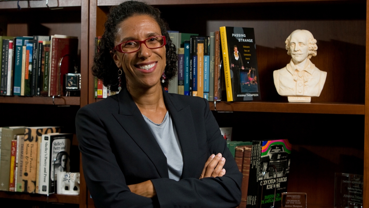ASU Professor Ayanna Thompson standing in front of bookshelves