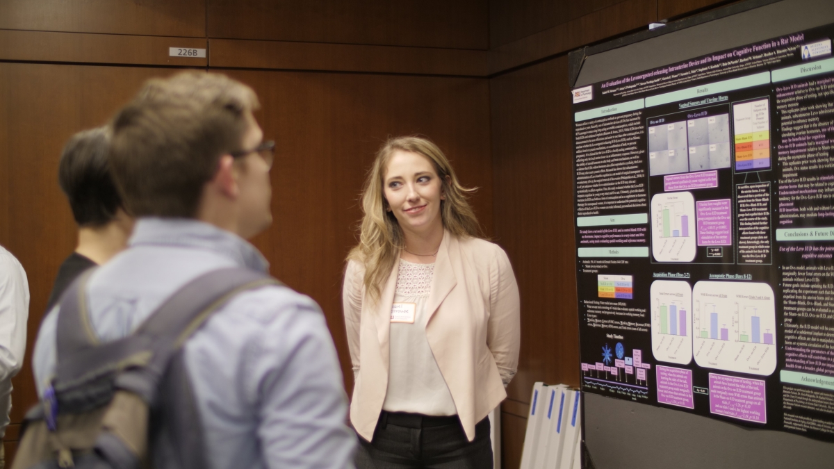 Psychology alumna and Dean’s Medalist, Isabel Strouse, practices presenting her award-winning research in front of her peers. Photo: Robert Ewing