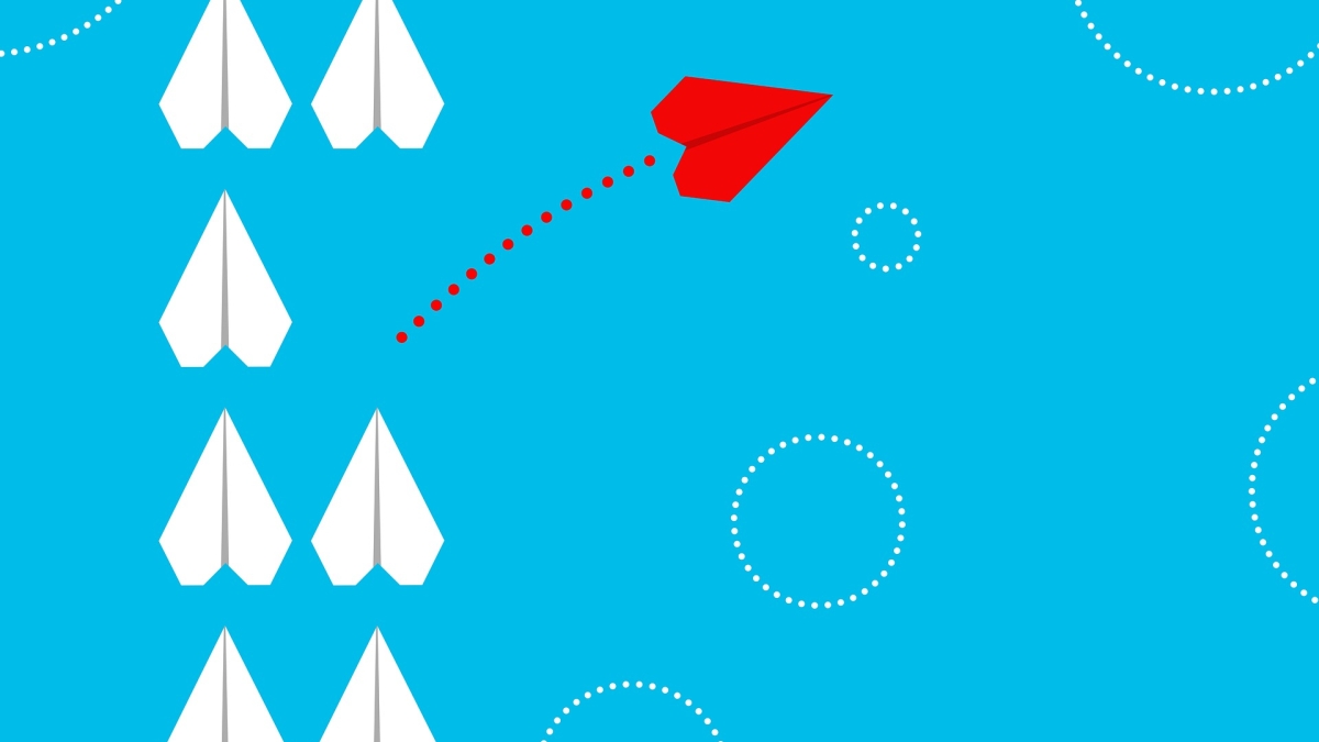 Illustration of rows of paper airplanes, with one red airplane veering off out of line from the others.