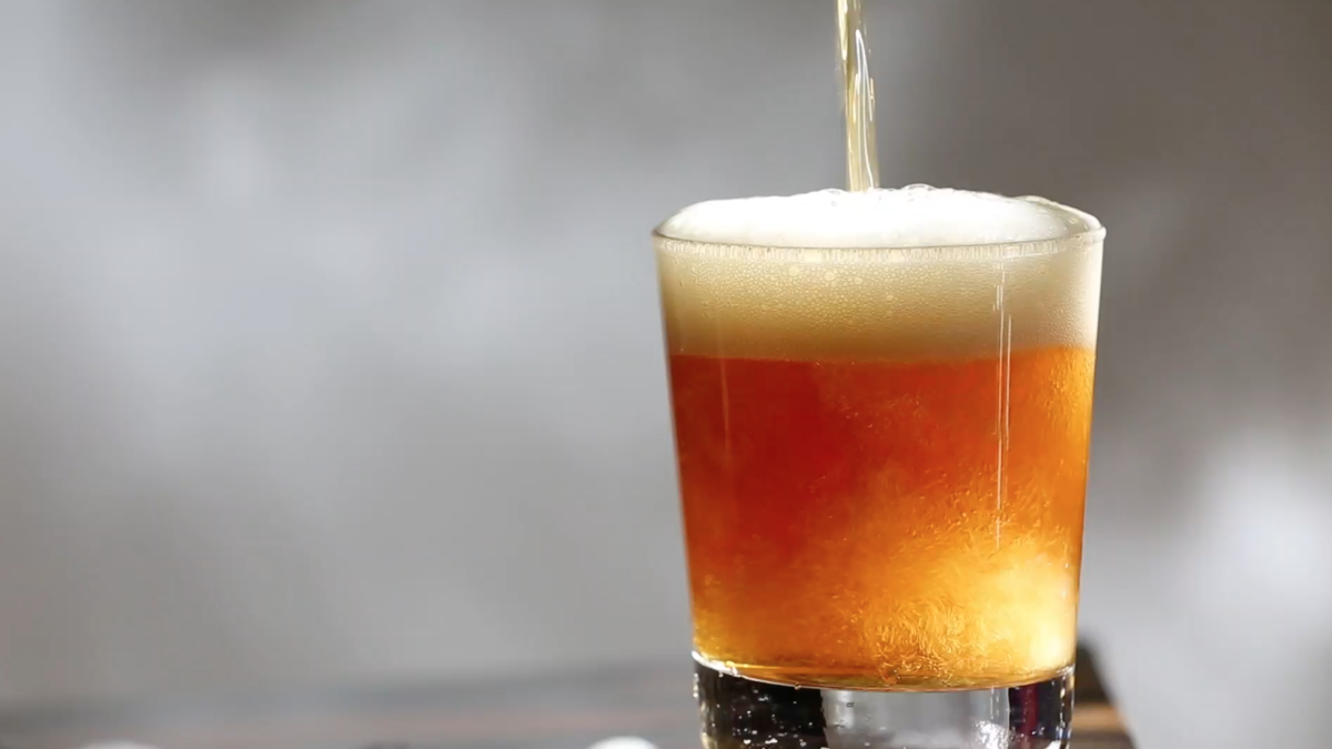 beer pouring into a glass