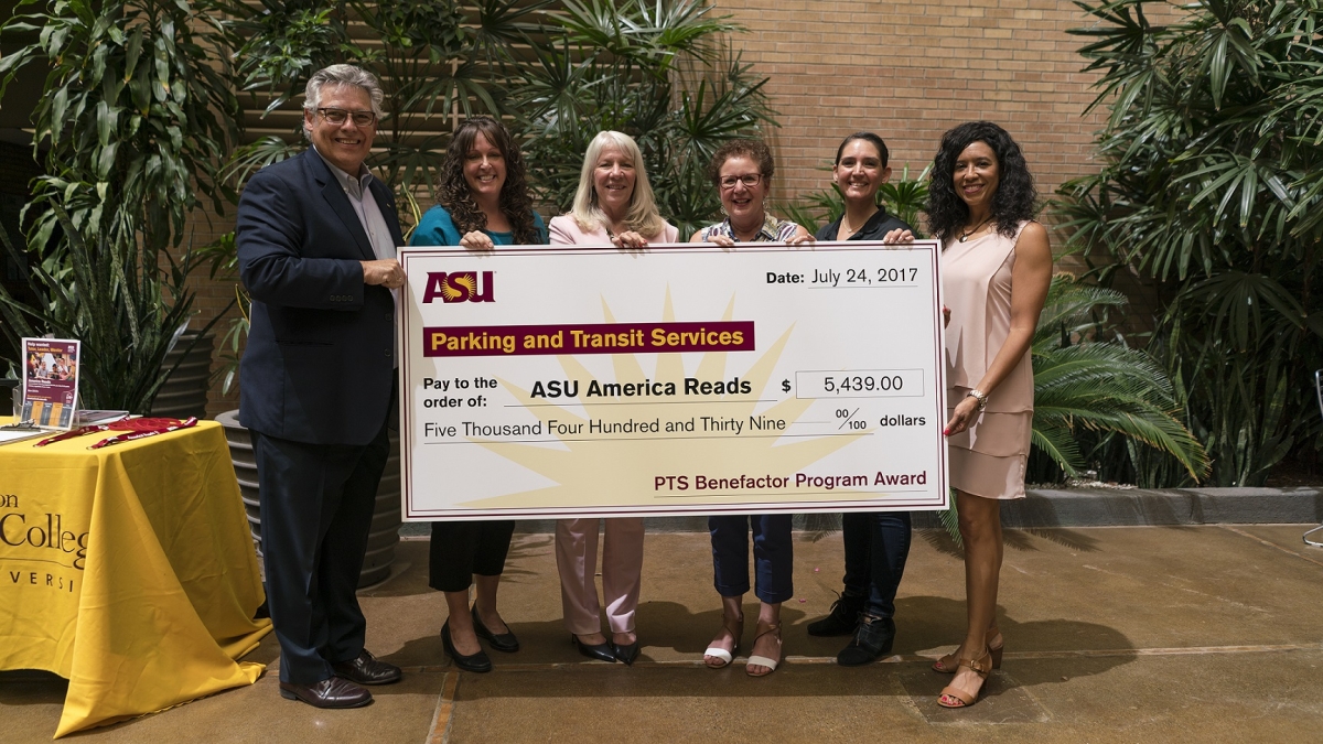 Parking and Transit Services present ASU America Reads with funds from the 2016-17 PTS Benefactor Program. From left: Ray Humbert, PTS associate director; Deborah Ruiz, community engagement programs director; Associate Dean Nancy Perry, Mary Lou Fulton Te