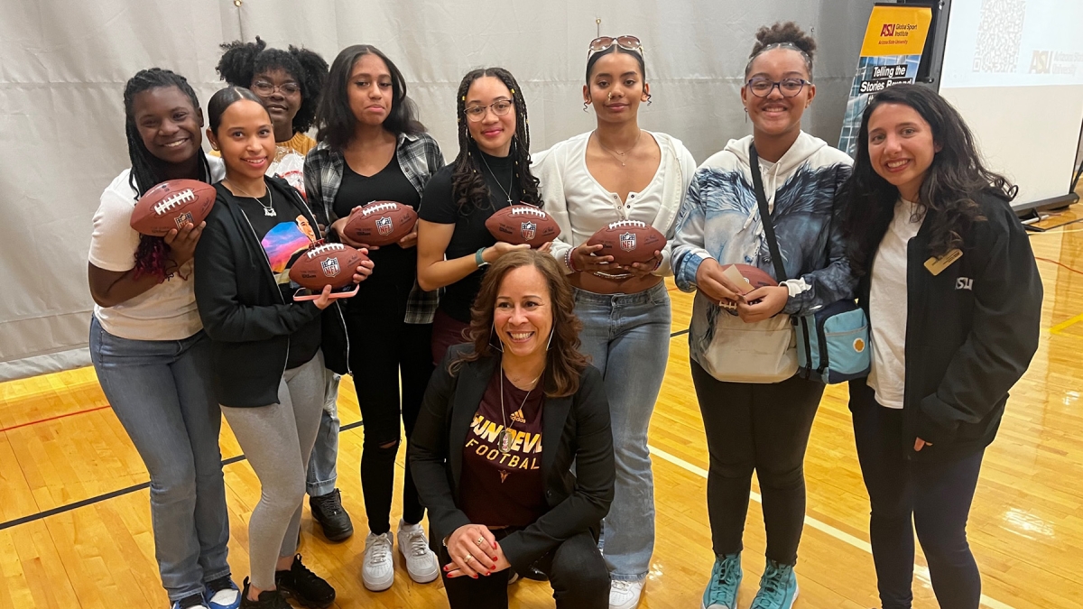 Collette Smith posing with a group of students who attended the Black Changemaker Youth Town Hall.