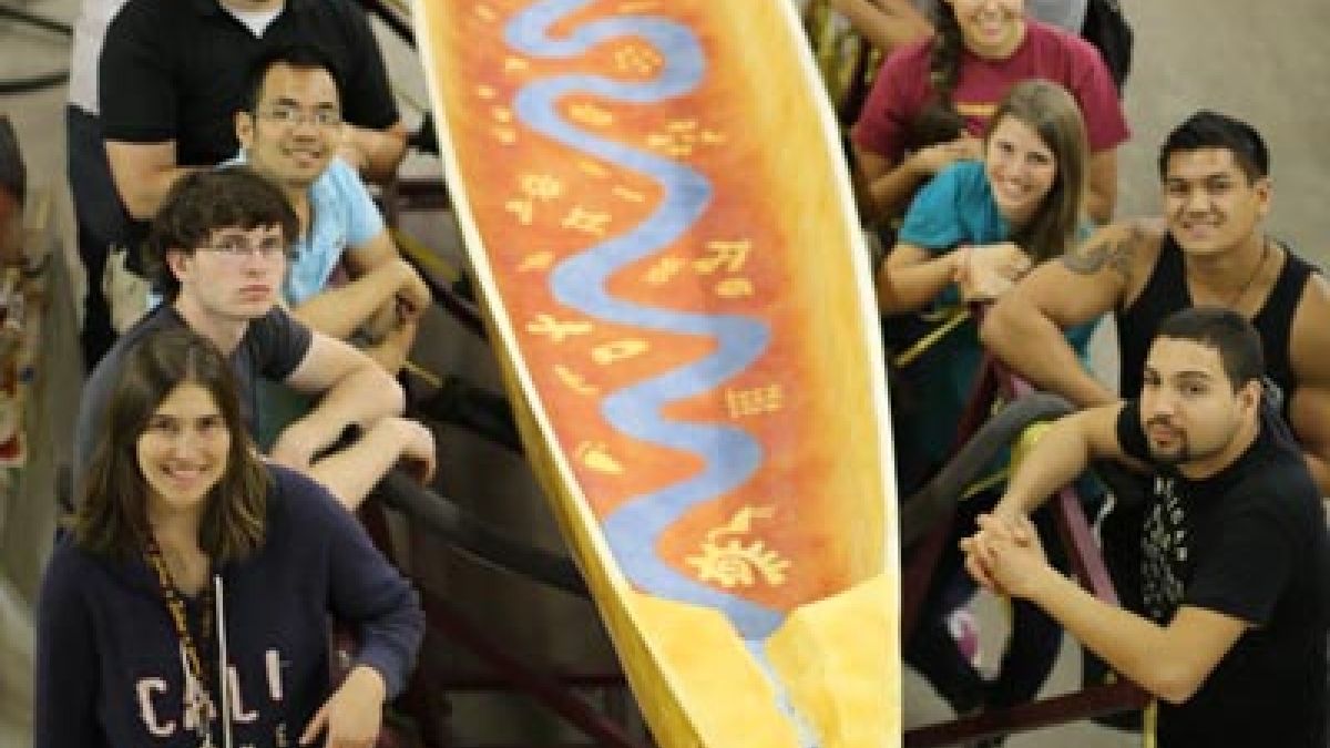 ASU students pose with concrete canoe