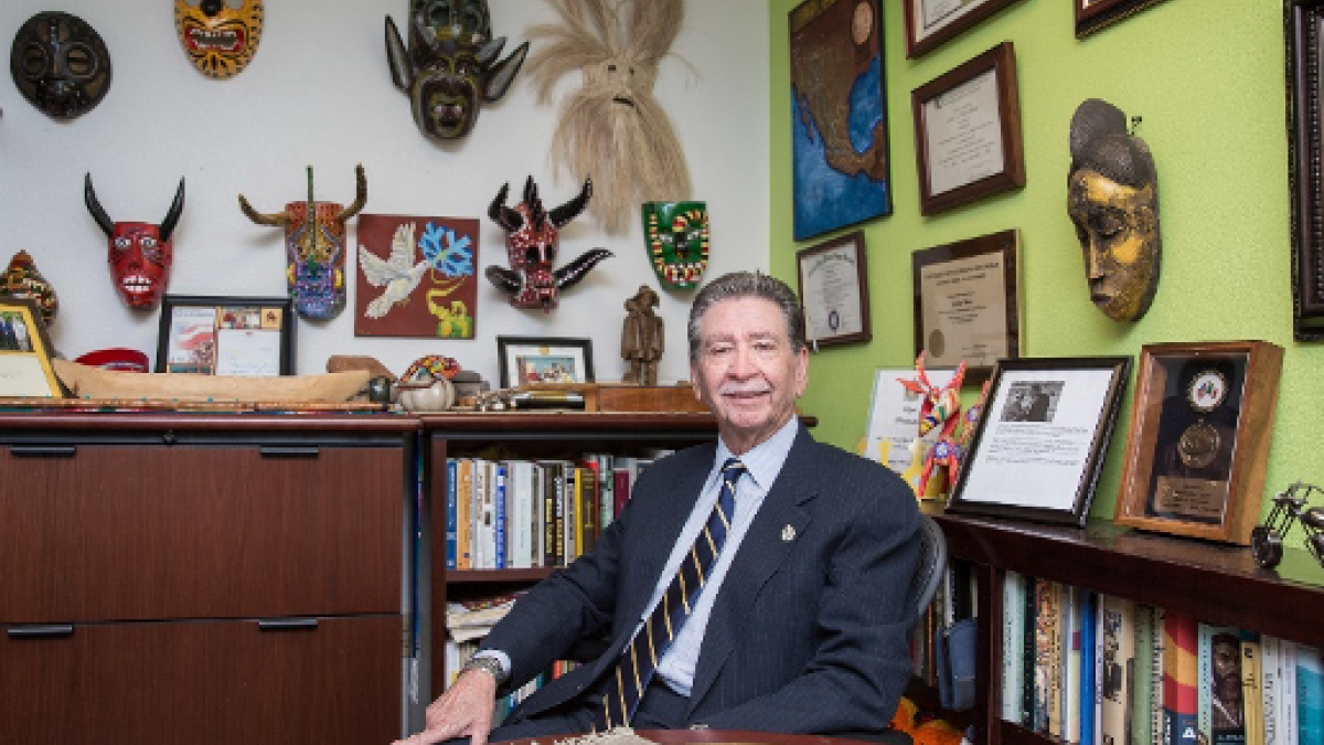 ASU Regents Professor Carlos Velez-Ibanez in his office