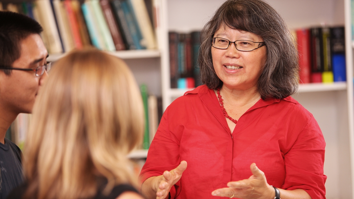 woman speaking to students