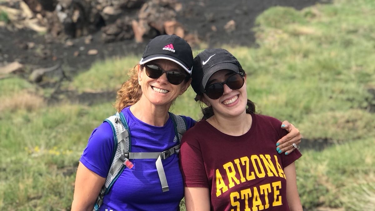 Principal Lecturer Chiara Dal Martello, left, stands with undergraduate student Bianca Navia at the top of Mt. Etna in Sicily, Italy, in June 2018.