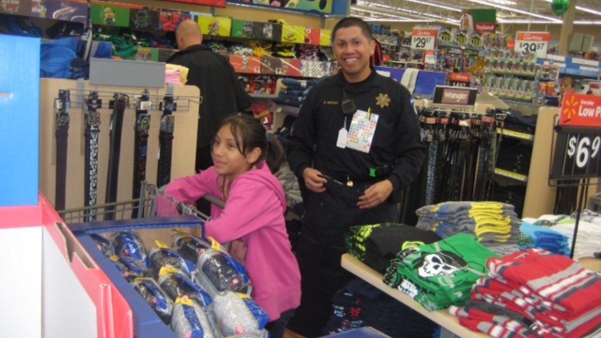 Sgt. Macias shopping with a child 