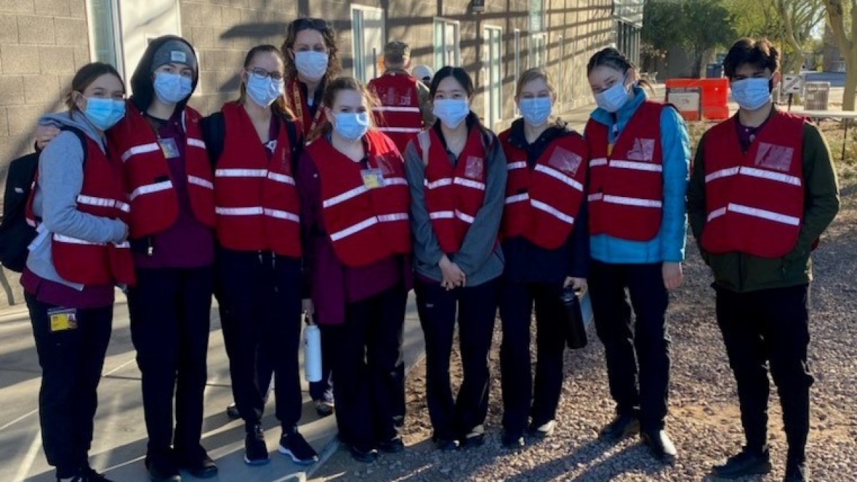 Edson College students pose before starting their shift at a COVID-19 vaccination site in the East Valley