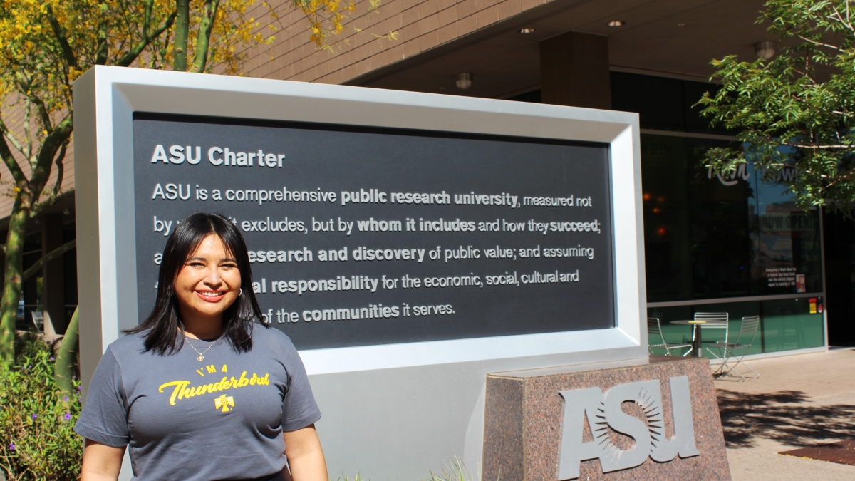 Dina De Leon poses in front of the ASU charter