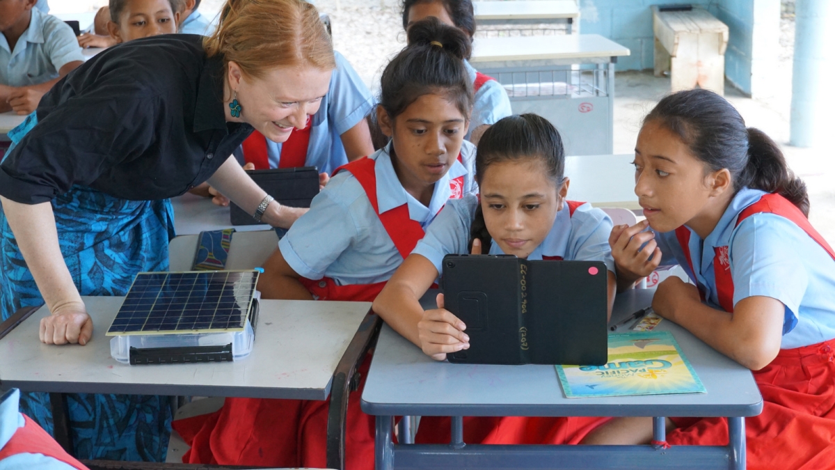 Laura Hosman works with kids and SolarSPELL in Samoa 