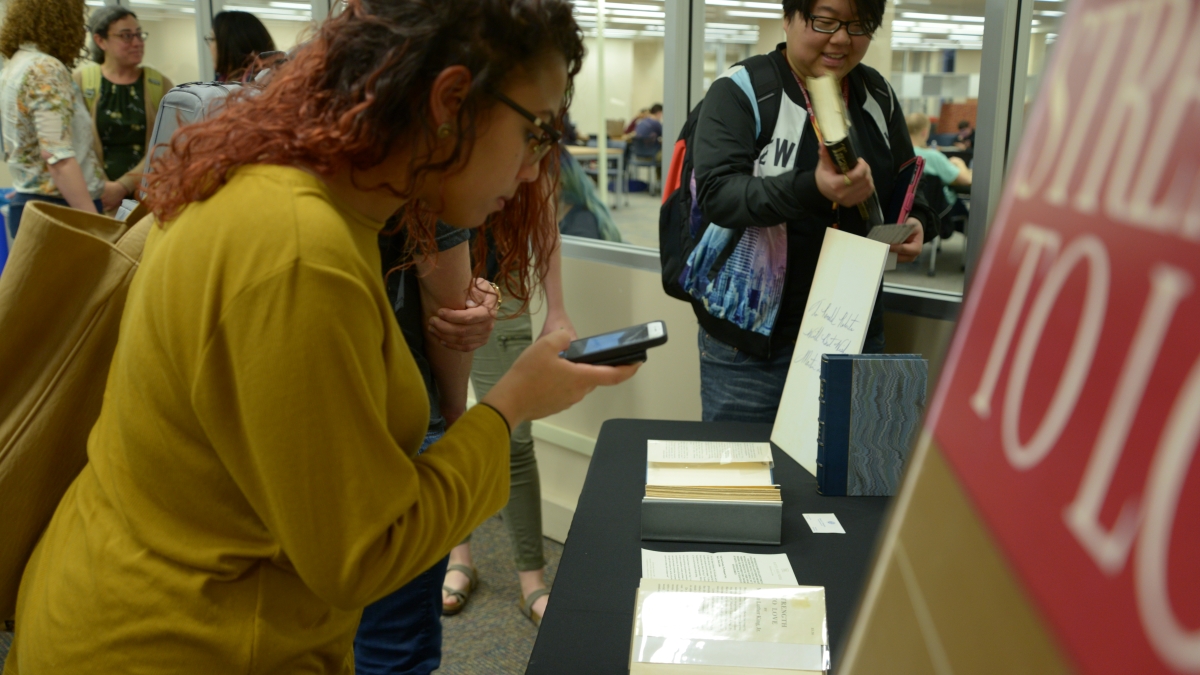 Students view signed copies of Martin Luther King Jr. Strength to Love Stride Toward Freedom