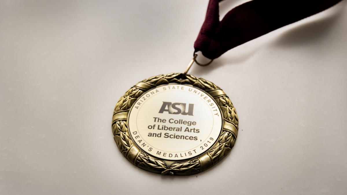 One of The College's 2019 Dean's Medal displayed. 