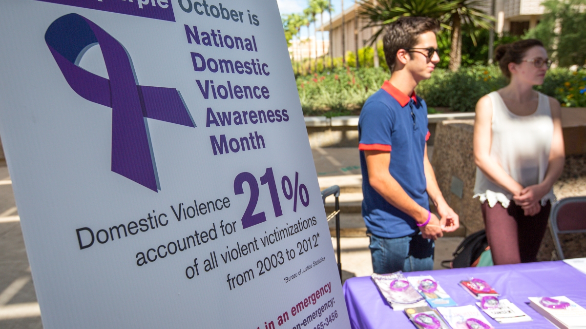 two people at a table for Domestic Violence Awareness Month