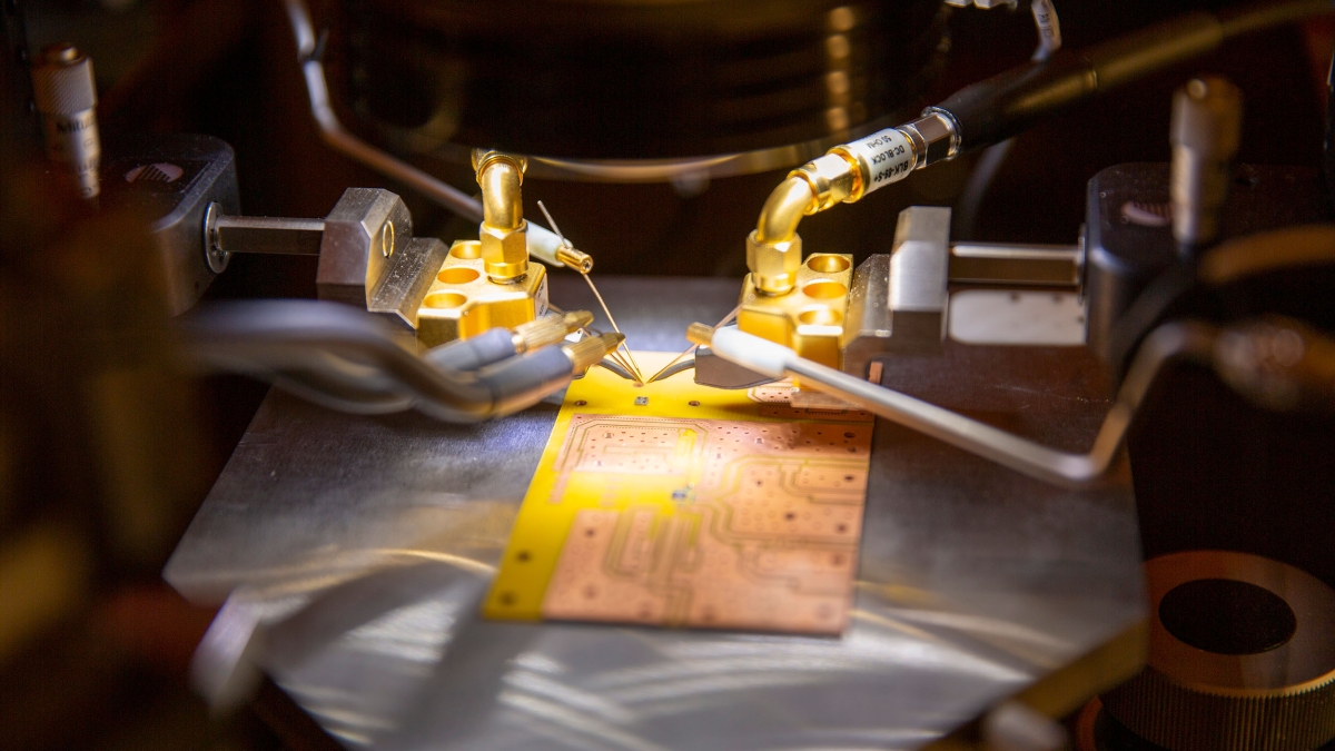 A semiconductor undergoes electrical testing in a lab.