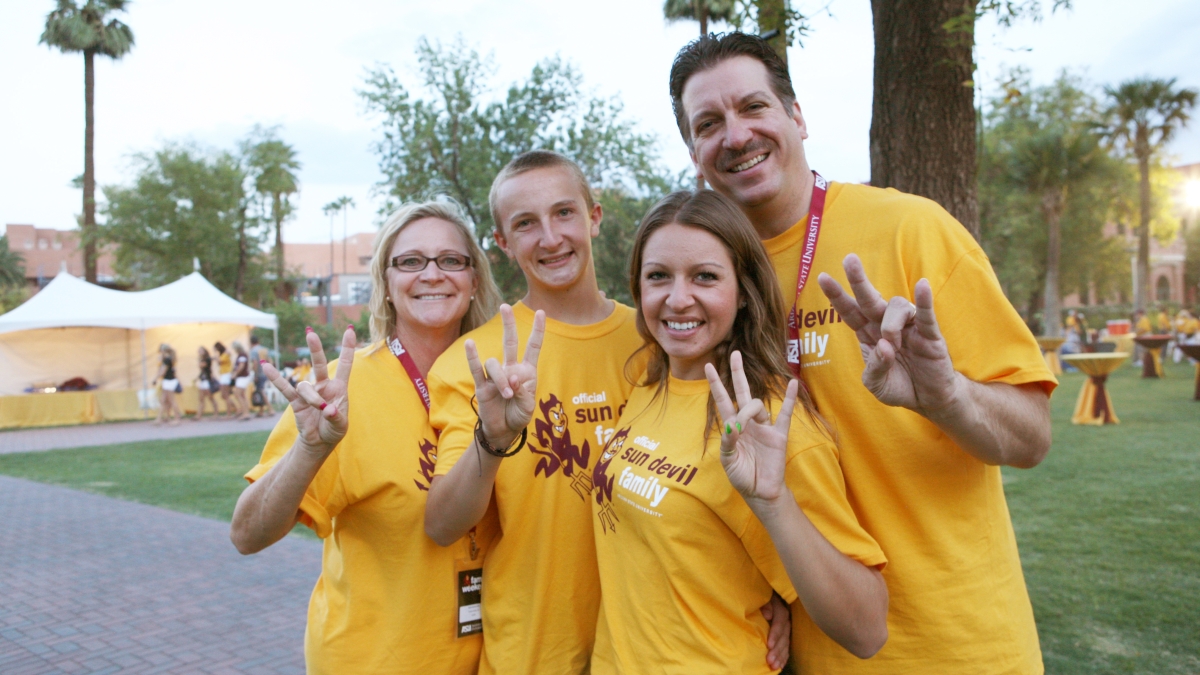 Sun Devil family displaying the pitchfork