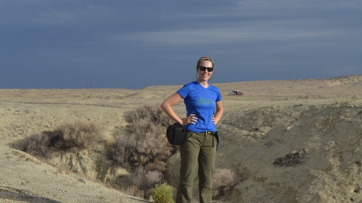 Arizona State University grad student Emily Kleber poses in the field