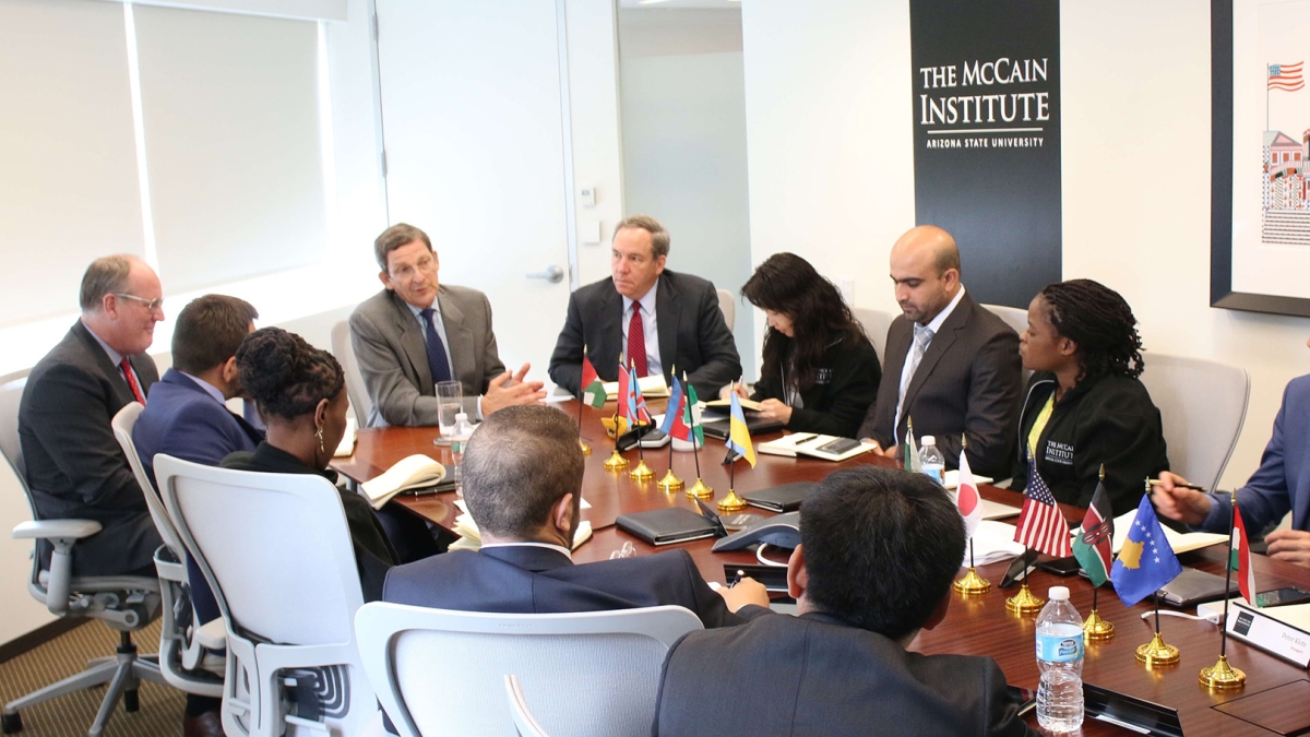 The McCain Institute's Ethan Kapstein leads a meeting in Washington, D.C.