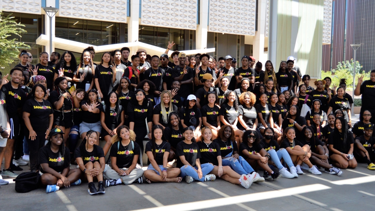 Large group of students pose for a photos at the Sankofa Welcome at ASU, fall 2022