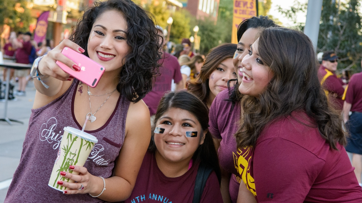 family taking a selfie during family weekend at ASU