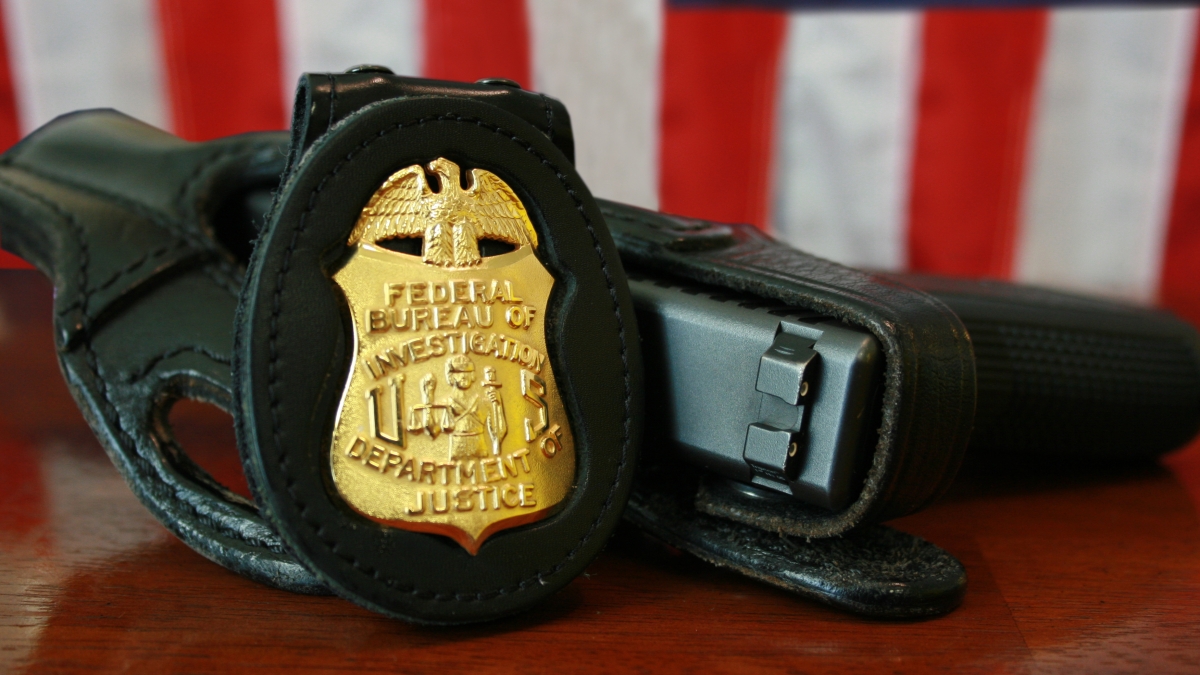 FBI badge and gun