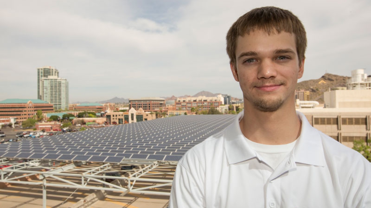 Nicholas Fortenberry overlooks solar energy modules at ASU
