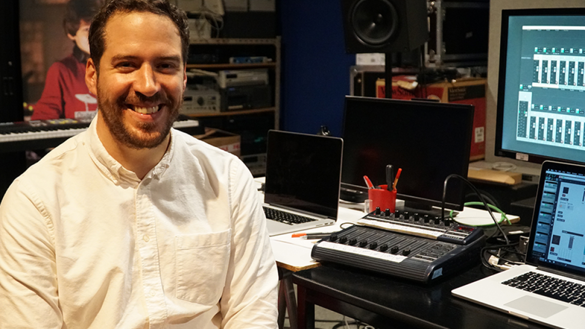 ASU Assistant Professor Gabriel José Bolaños seated and smiling in a music studio.