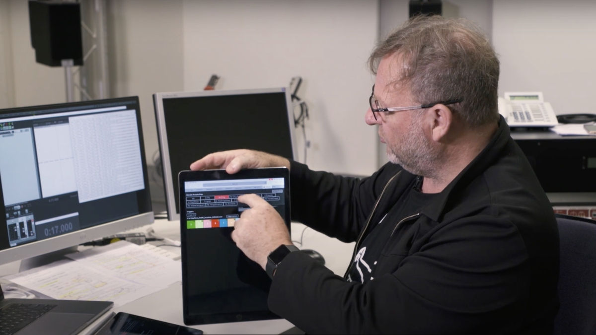 Screen shot from documentary of Garth Paine showing how his sytsem works using tablets. 