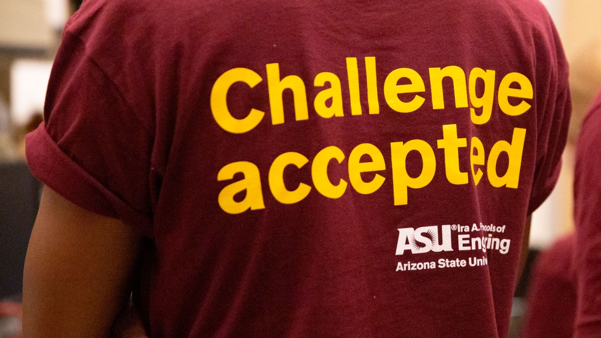A student in the Grand Challenges Scholars Program at ASU wears a t-shirt that says “Challenge Accepted.”