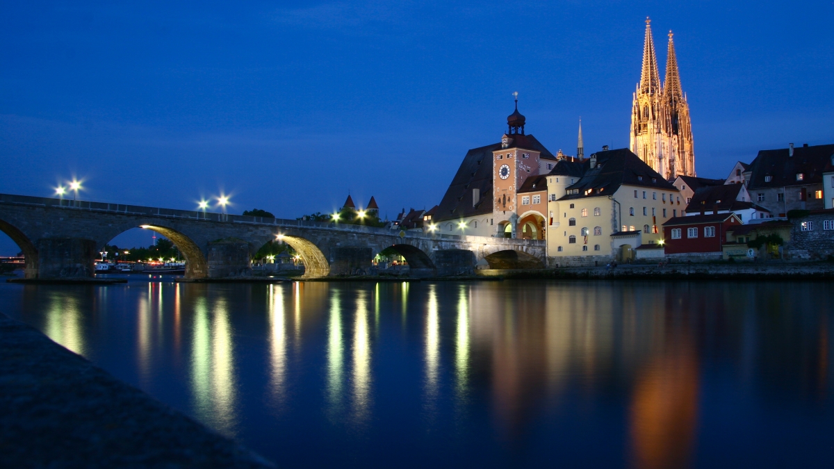 Regensburg, Germany, at night from across a lake