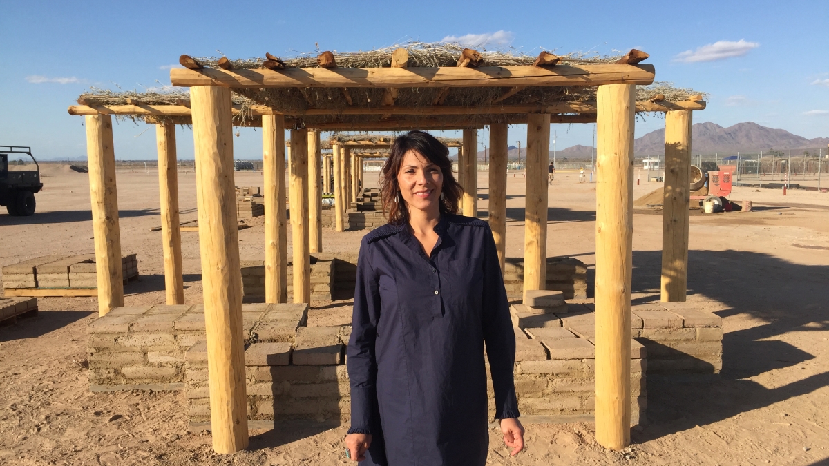 Herberger Institute Professor Wanda Dalla Costa in front of a shade structure she built in Gila River Indian Community.