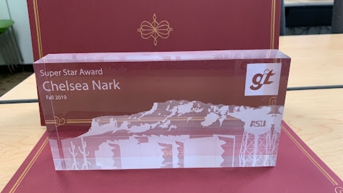 Close-up of a GIT Award, featuring an illustration of the ASU water tower and mountain scenery in the background.
