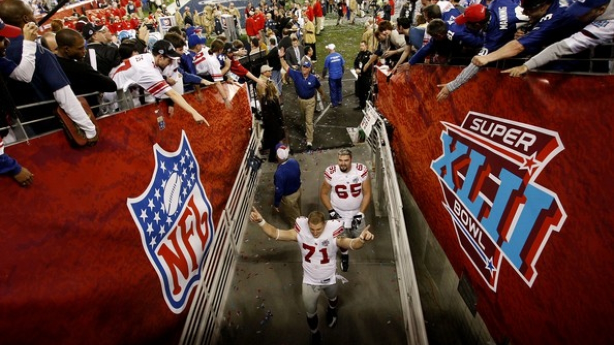 photo of players walking out of stadium after Super Bowl win