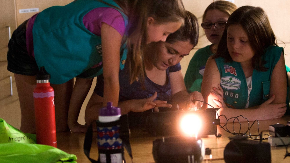 Girl Scouts study model of the human eye at ASU Polytechnic campus
