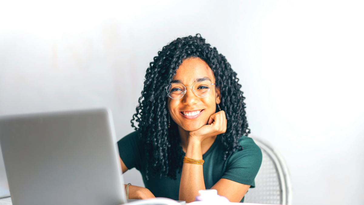 smiling woman using a laptop