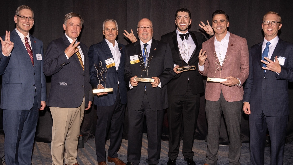 President Michael Crow, Dean Ohad Kadan, and Will Carey pose with the Hall of Fame inductees.