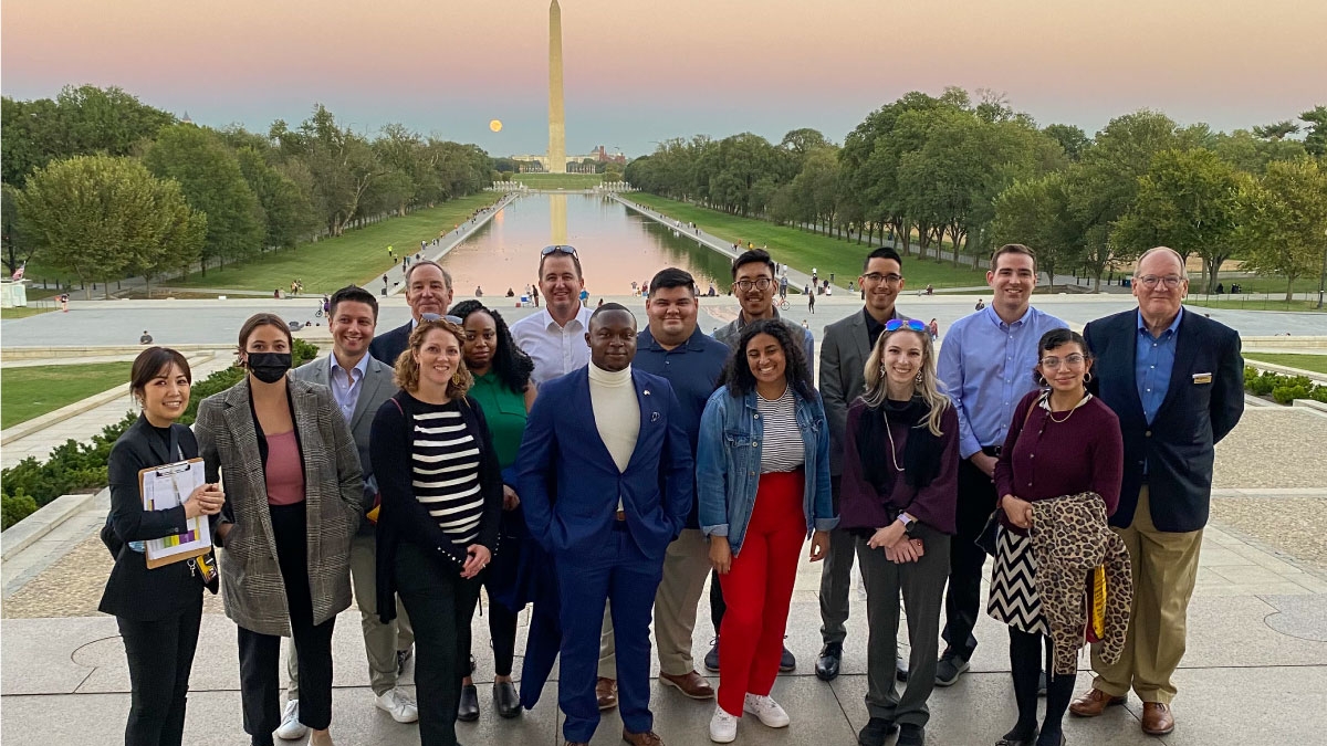ASU Online Master of Arts International Affairs and Leadership students stand together with the Washington Monument in the background.
