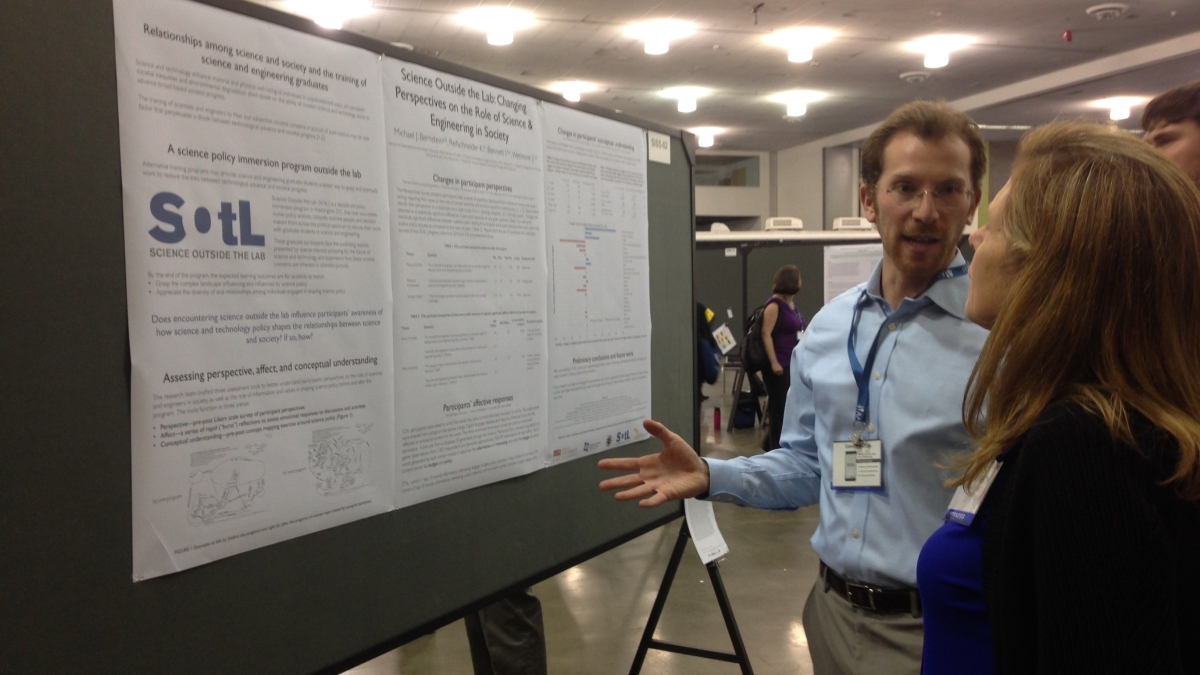 Michael Bernstein with winning poster at AAAS meeting