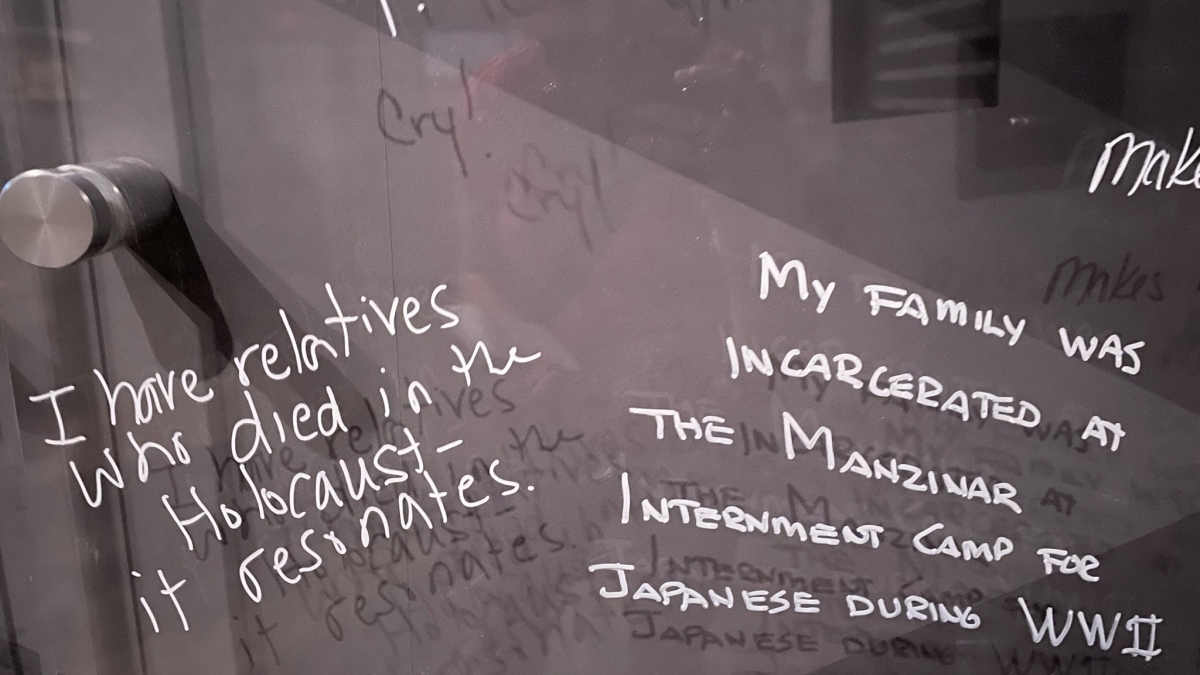Photo of a panel where people wrote about their family's history