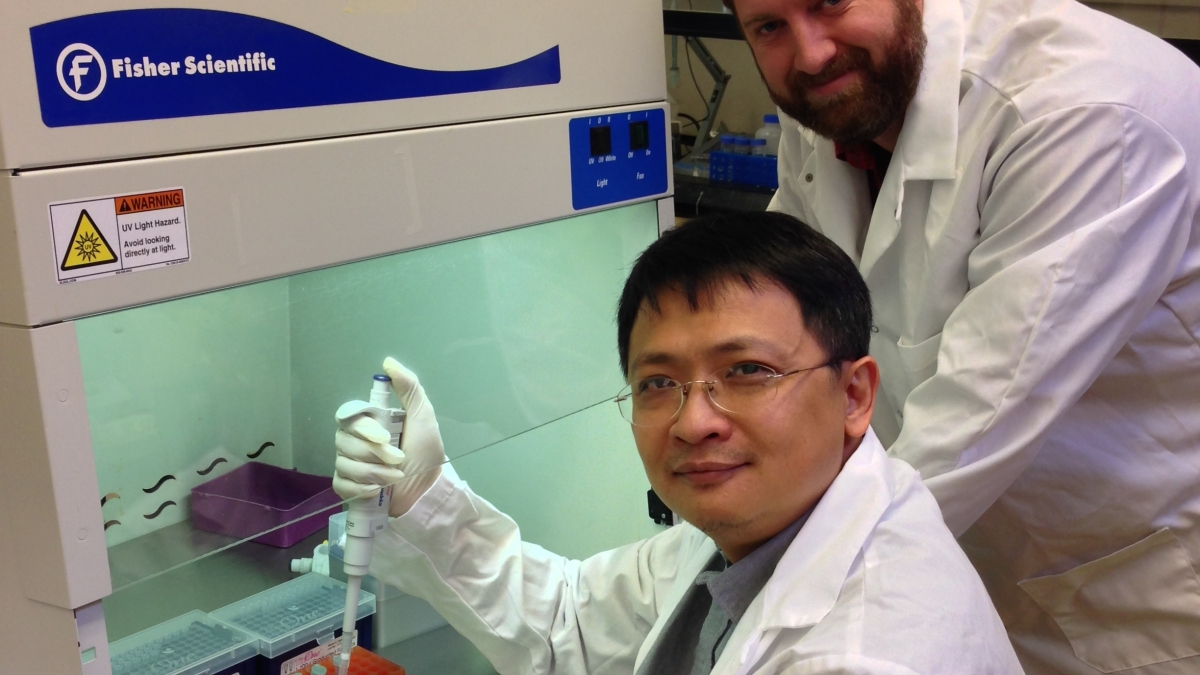 Julian Chen and graduate student Dustin Rand conduct research at ASU