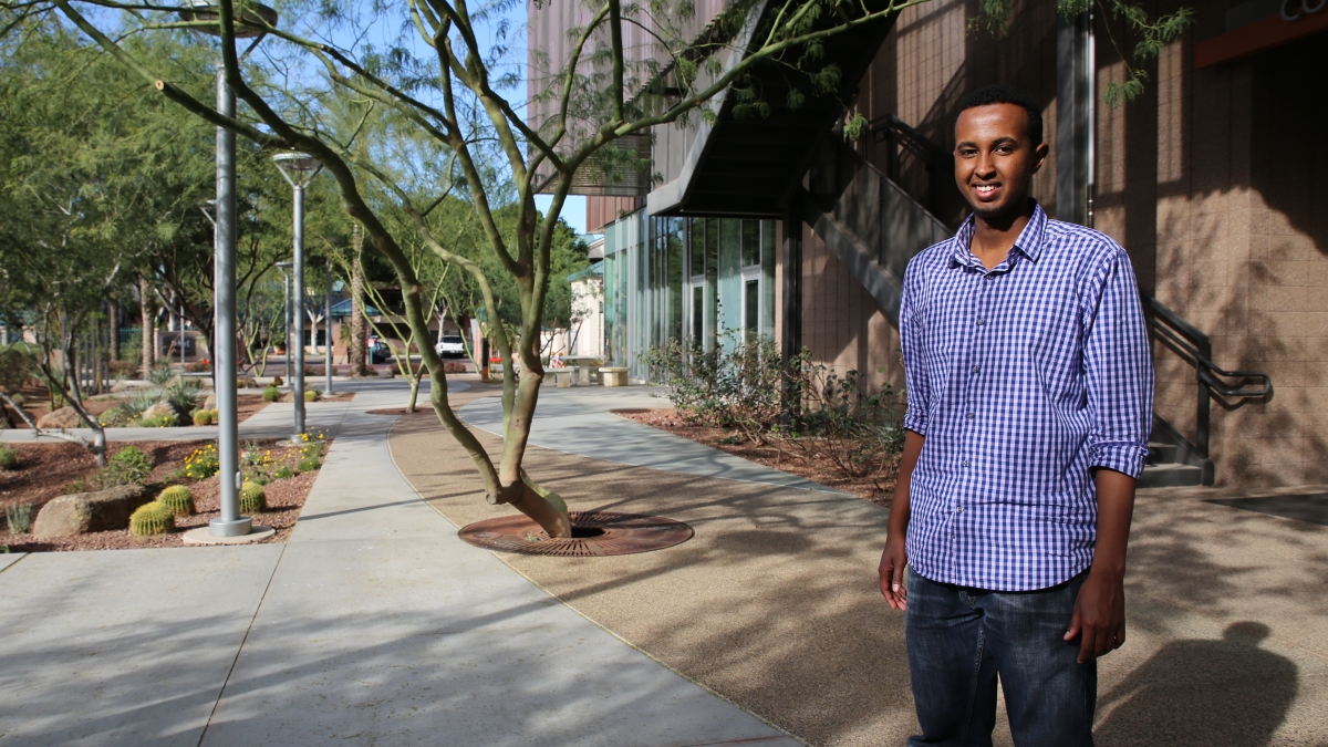 ASU student Mohamed Arif smiles on campus