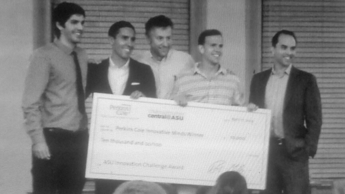 ASU students accepting $10,000 check at Innovation Challenge awards