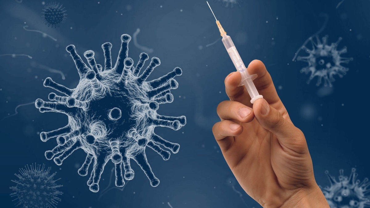 Illustration of a virus next to a photo of a hand holding a needle.
